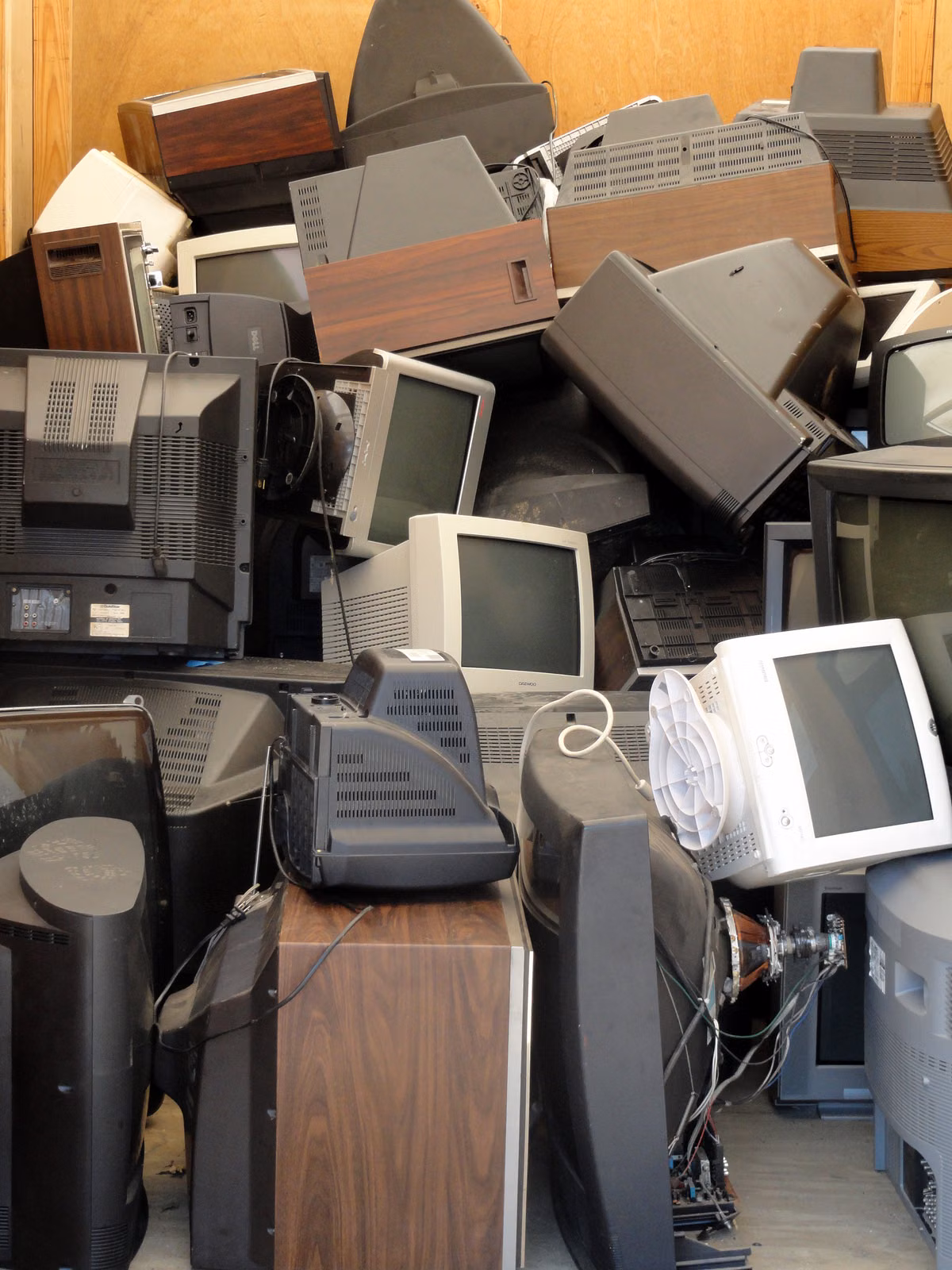 Besure Junk Removal crew collecting old electronics for e-waste recycling in Fort Lauderdale