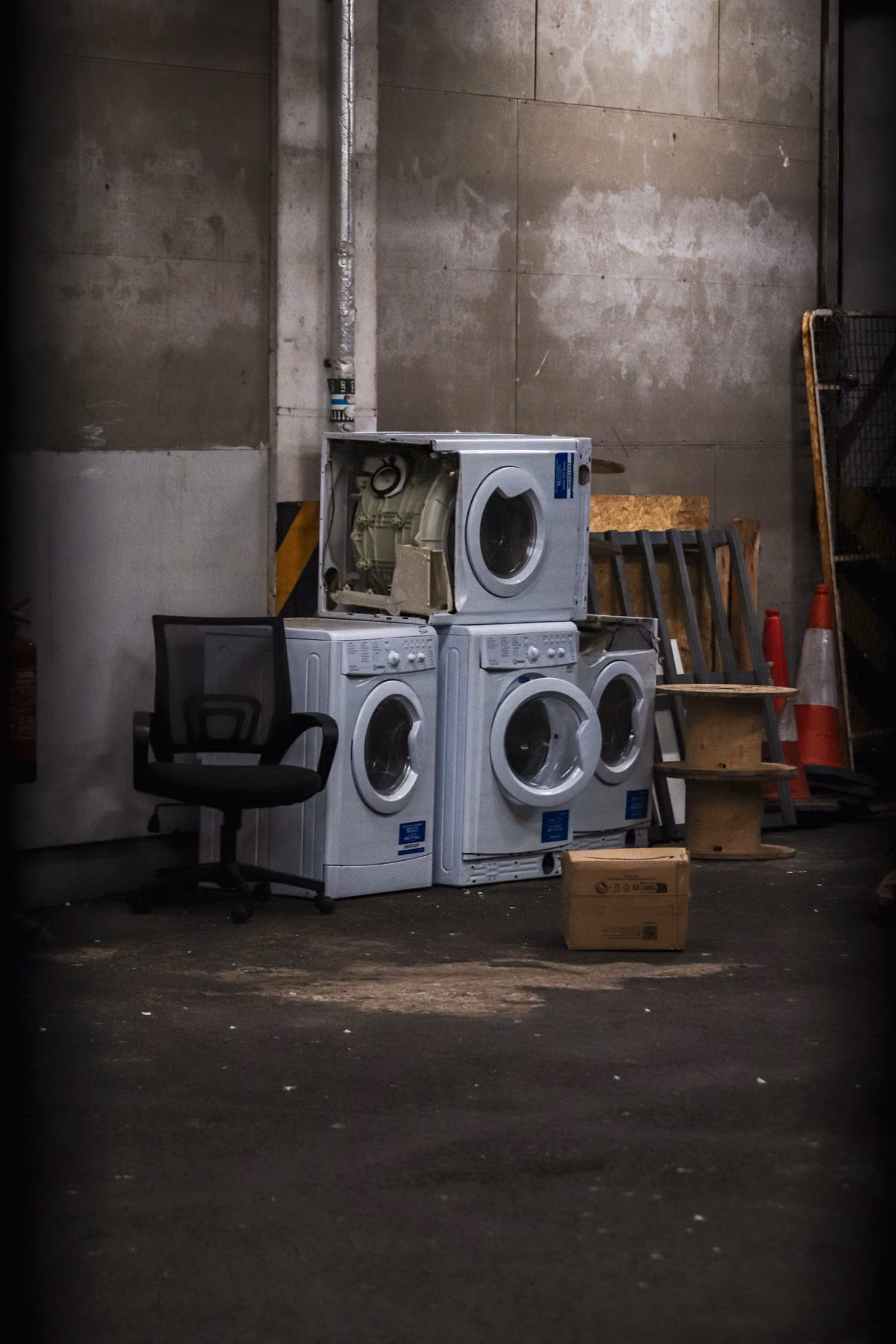 Besure Junk Removal team member hauling an old refrigerator from a Fort Lauderdale home